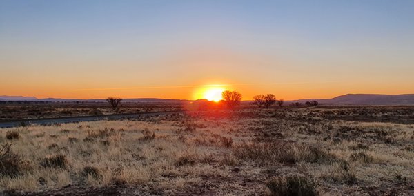 The sun sets on the African plain